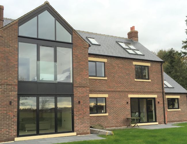 Aluminium Windows & Doors in UK fitted on a modern commercial building with sleek aluminium frames and glass panels